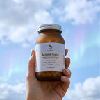 ELIVIDE magnesium malate supplement bottle held in hand